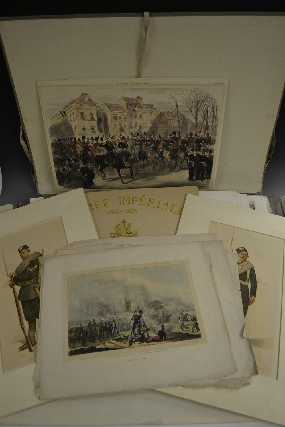 A portfolio of military prints and posters, including Napoleonic Wars scenes,