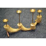 A four branch pricket candelabra fashioned as a large ginger root.