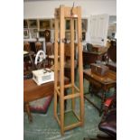 A mid 20th century Beechwood, obelisk-form hall stand by D Matthews and Son, c.