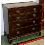 A George III oak chest, two short drawers over three graduated long, brass escutcheon's,