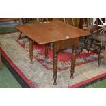 A Victorian mahogany Pembroke table, moulded top, hidden drawer to frieze, turned legs, circa 1880.