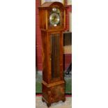 A mahogany veneered grandmother clock, FHS movement, arched dial, gilt spandrels,