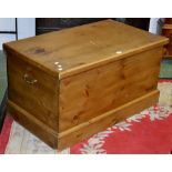 A contemporary pine blanket chest