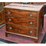 A George III mahogany chest, crossbanded top, three cockbeaded graduated drawers, ring handles,