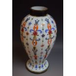 A 19th century French painted milk glass vase, painted with floral motifs,