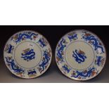 A pair of Minton Chinese dragon and bird wall plaques