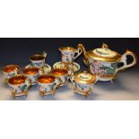 A Capodimonte tea set for six, moulded with putto,