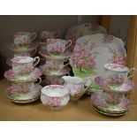 A Royal Albert Blossom Time tea service comprising thirteen cups, twenty four saucers,