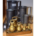 Metalware - a set of seven graduated Dutch pewter straight sided measures;