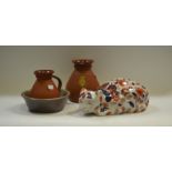 Ceramics - an Oriental stoneware model of a cat painted in the Imari palette,