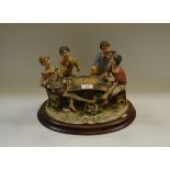 A Capodimonte bisque porcelain figural group, 'The Cheats',