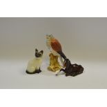 Beswick - a Beswick bisque model of a kestrel; a Beswick model of a seated Siamese cat;