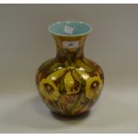 A George Jones-style shaped baluster vase, painted with stylised Hibiscus flowers,