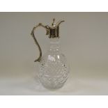 A silver-topped cut glass claret jug,