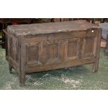 An 18th century oak blanket box, plank top, four panels to front, fluted stile feet,