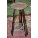 An Arts and Crafts occasional table, circular incised top,