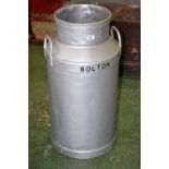 A silver painted Bolton Coop society Ltd. milk churn.