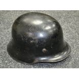 A West German Army Stahlhelm or steel helmet, stamped DIN 14940,