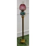 A Victorian oil lamp, brass column,