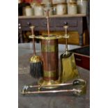 A copper and brass fireside companion set