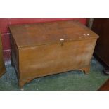 A scumbled pine chest, hinged cover, ogee feet, circa 1920.