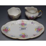 A Shelley strawberry set on stand comprising cream jug and sugar bowl on oval stand,