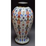 A 19th century French painted milk glass vase, painted with floral motifs,