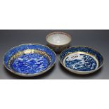 Two early blue and white saucers and an 18th century tea bowl (3)