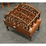 A Victorian walnut Canterbury, four pierced sections, drawer to base,