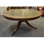 A mid 20th Century mahogany circular coffee table,
