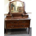 An Edwardian mahogany dressing chest, barberpole stringing throughout, tapering legs c.