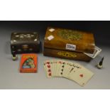 A Victorian brass mounted domed topped games box, inc linen backed playing cards,