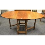 A George III style oak oval gateleg dining table