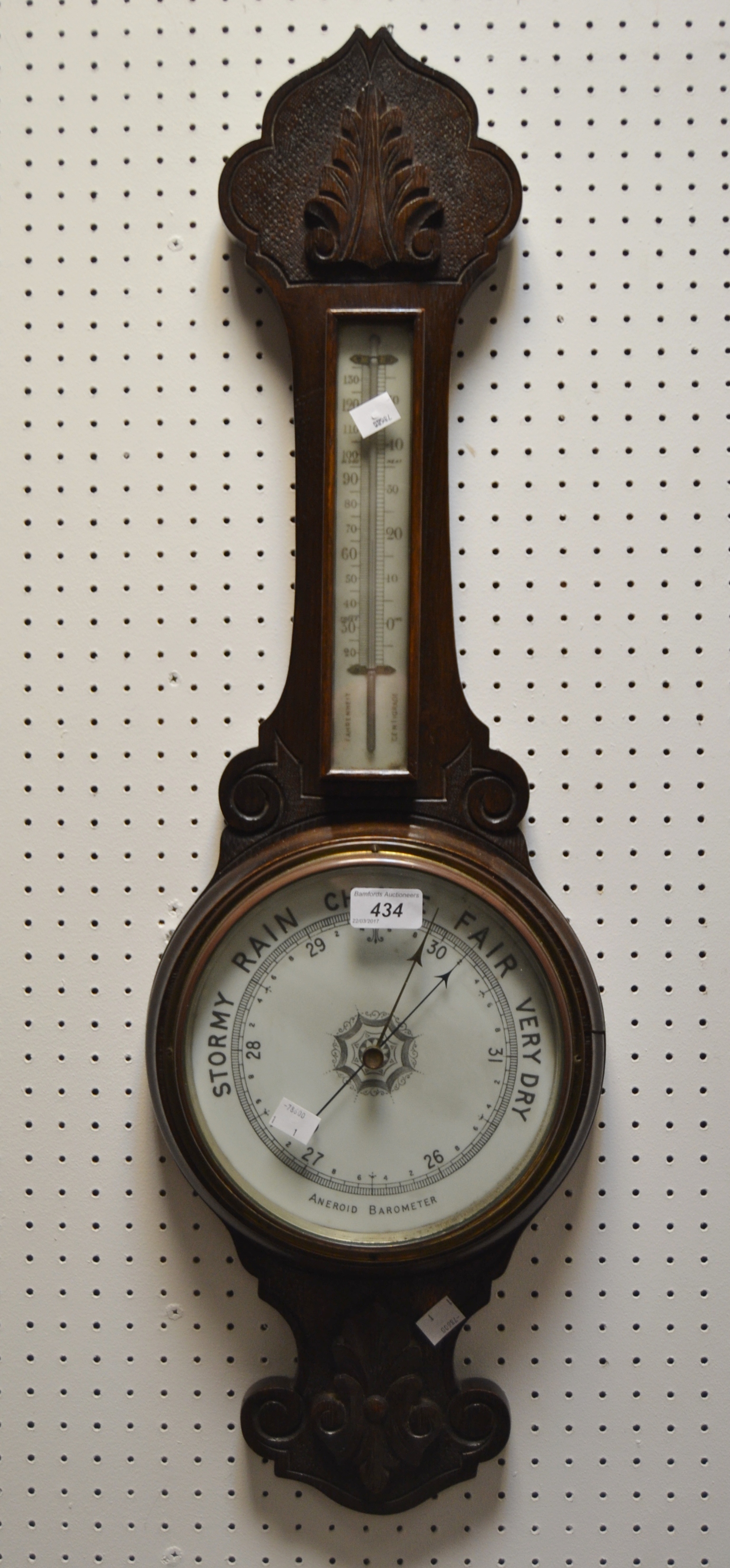 An early 20th century oak wheel barometer