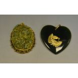 A New Zealand jade heart pendant;