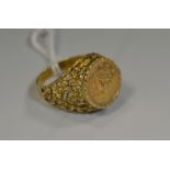 A gold coloured ring inset with an Italian Tallar coin, dated 1853,