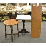 An early 20th century oak circular occasional table, beaten copper top,