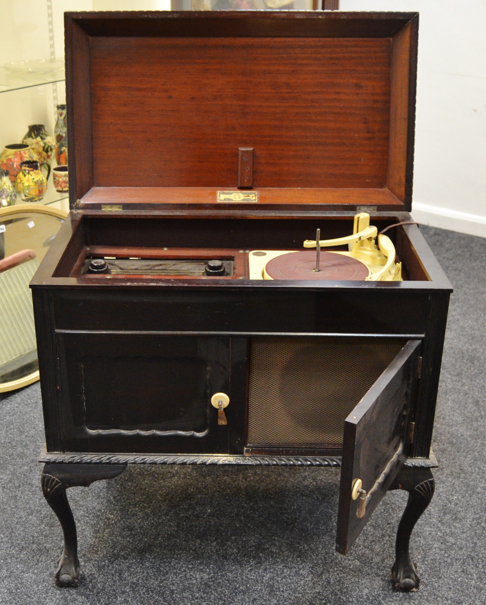 An early/mid 20th century cased Golden Memory radio and record player,