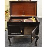 An early/mid 20th century cased Golden Memory radio and record player,