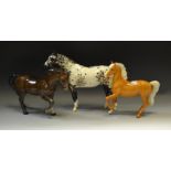 Beswick - a Palomino pony raised foreleg; an Appaloosas horse (chipped ear);