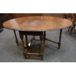 An early 20th century oak gateleg dining table, barley twist supports, c.