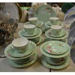 A Worcester part tea service painted with floral bouquets on an apple green ground