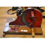 A Rotunda cast iron bacon slicer,