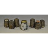 Six silver thimbles, various dates; 33.