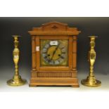 A Victorian oak mantel clock, twin winding holes,