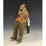 A Black Forest, lever action, carved nutcracker in the form of a bearded Gentleman,
