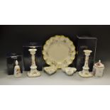 A pair of Royal Crown Derby Posies pattern candlesticks; a similar bell; trinket dishes;