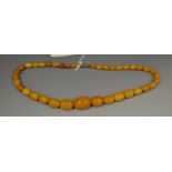 A set of honey amber beads, 23.
