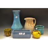 A Wedgwood Palm tree jug; Bretby planter; a Bretby/Wedgwood slip glaze vase;