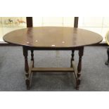 A mid 20th century oak drop leaf table